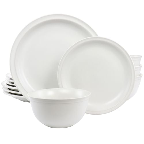 A 12 piece white stoneware dinnerware set including four dinner plates, four dessert plates, and four bowls.