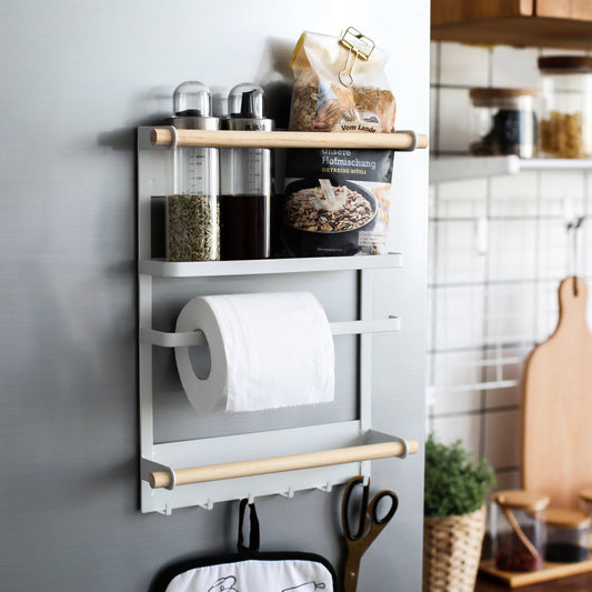 Wall-mounted kitchen organizer with shelves, a paper towel holder, and hooks in a kitchen setting.