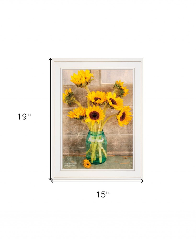 Framed artwork of sunflowers in a vase on a wooden background with dimensions indicated.
