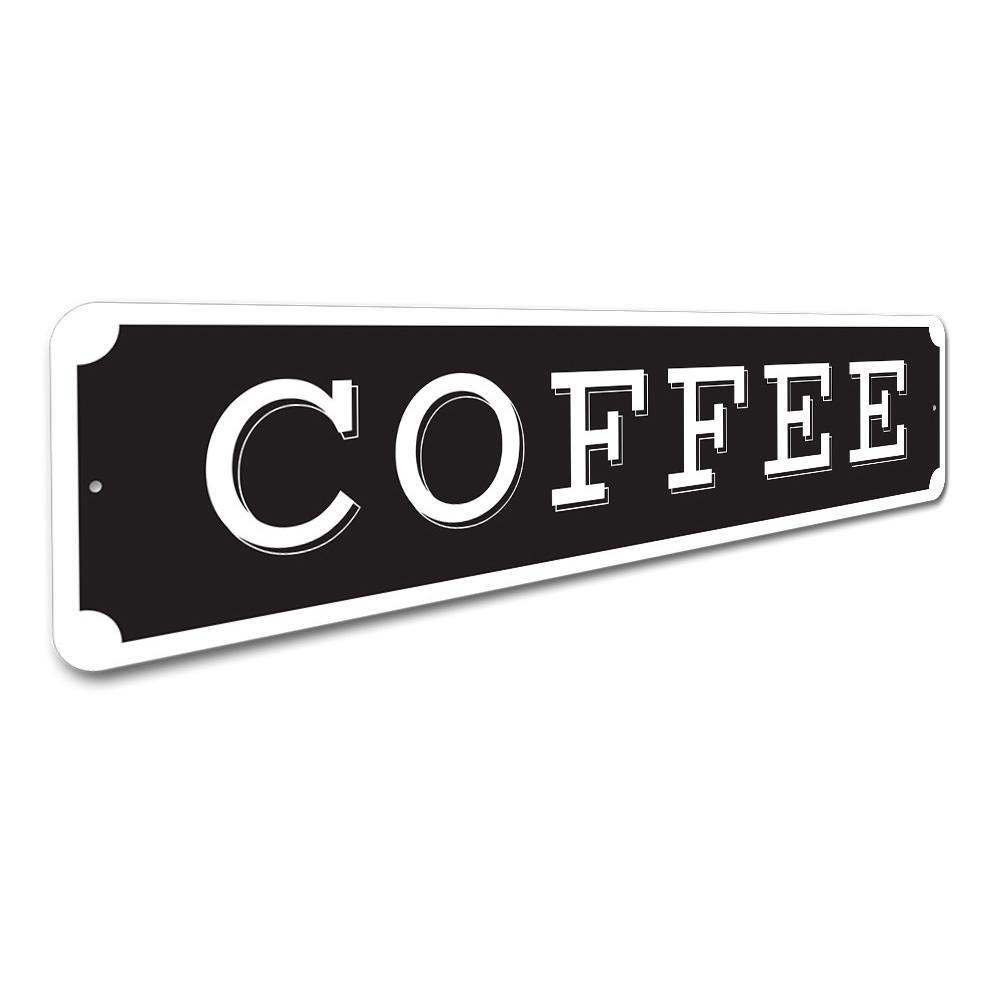 Black sign with 'COFFEE' in white letters on a white background