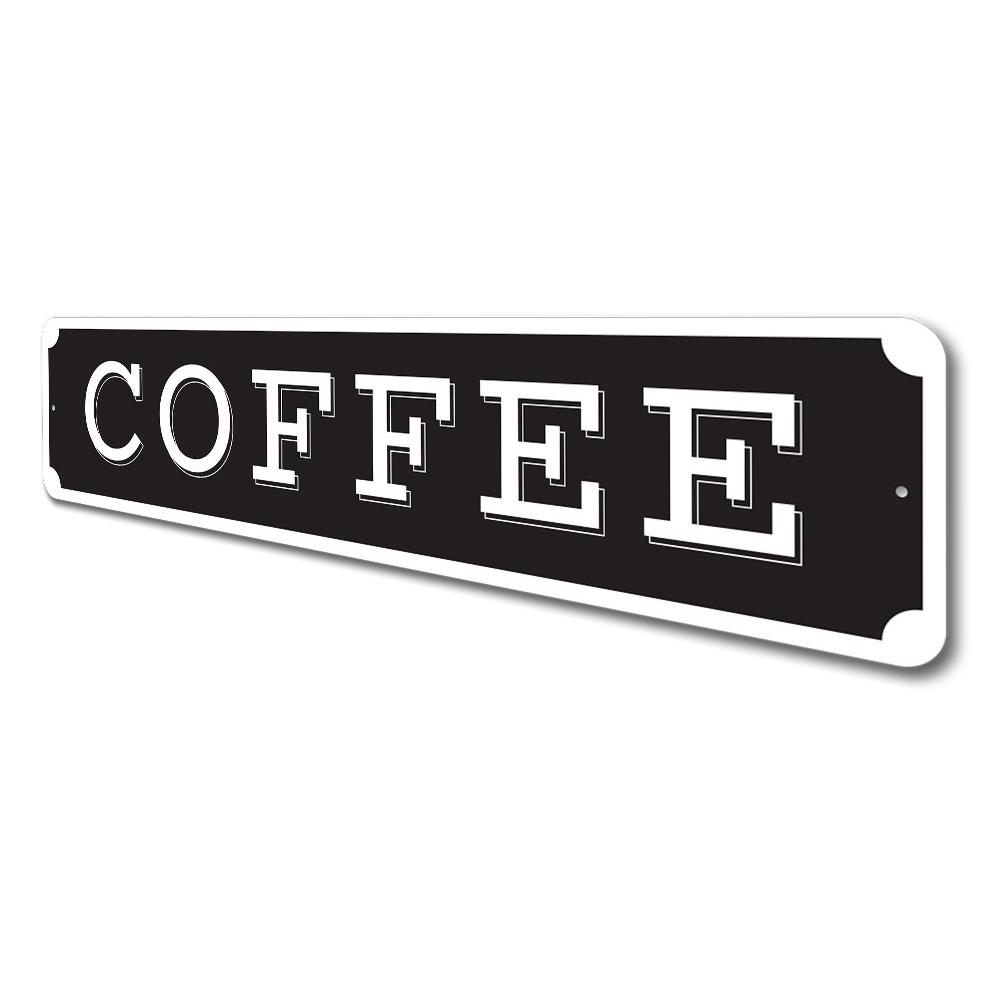 Black sign with 'COFFEE' in white letters on a white background