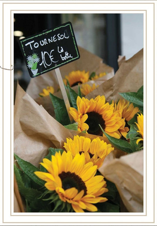 Bouquet of sunflowers with a price sign in the background