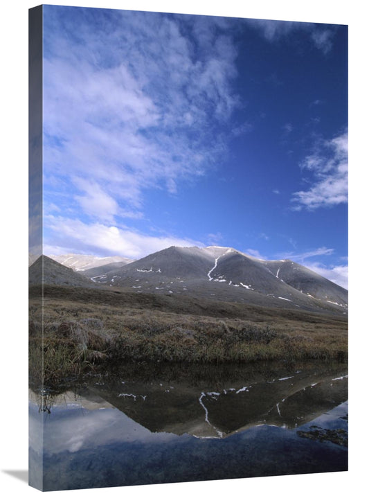 Mountain landscape with a lake and blue sky