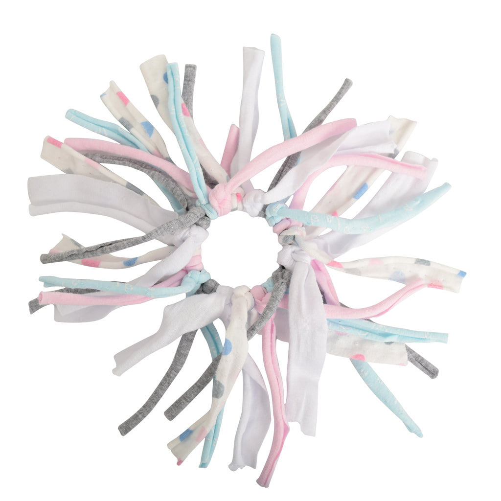 Circular dog toy with multicolored fabric strips on a white background