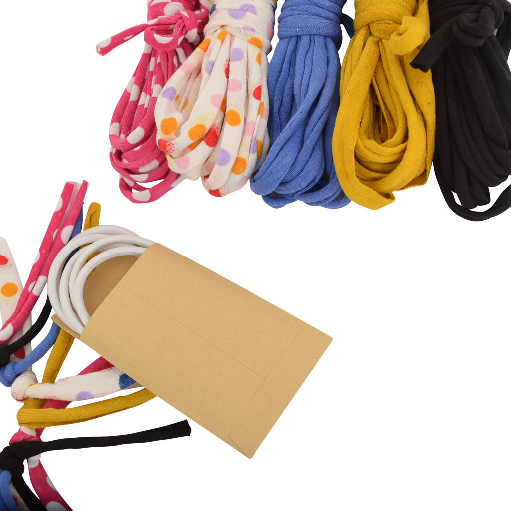 Colorful shoelaces with a cardboard piece on a white background