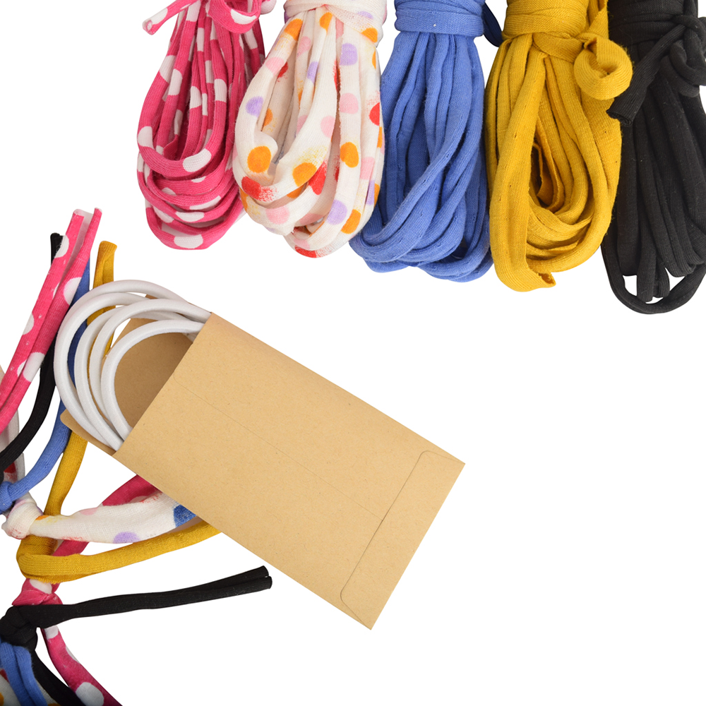 Colorful shoelaces with a cardboard envelope on a white background