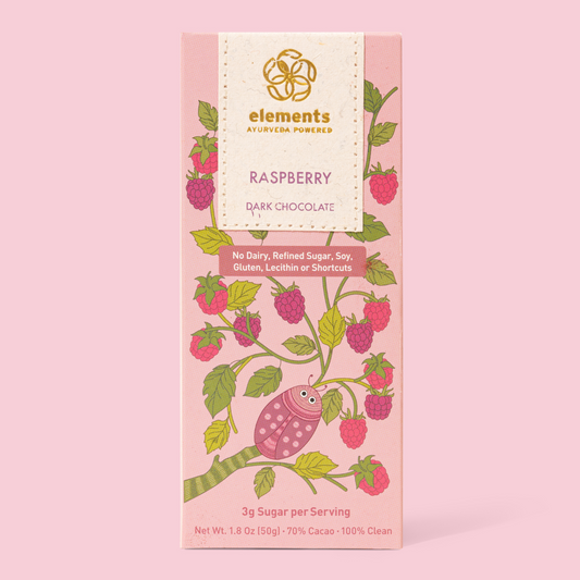 Pink packaging of raspberry dark chocolate with 'elements' branding on a pink background