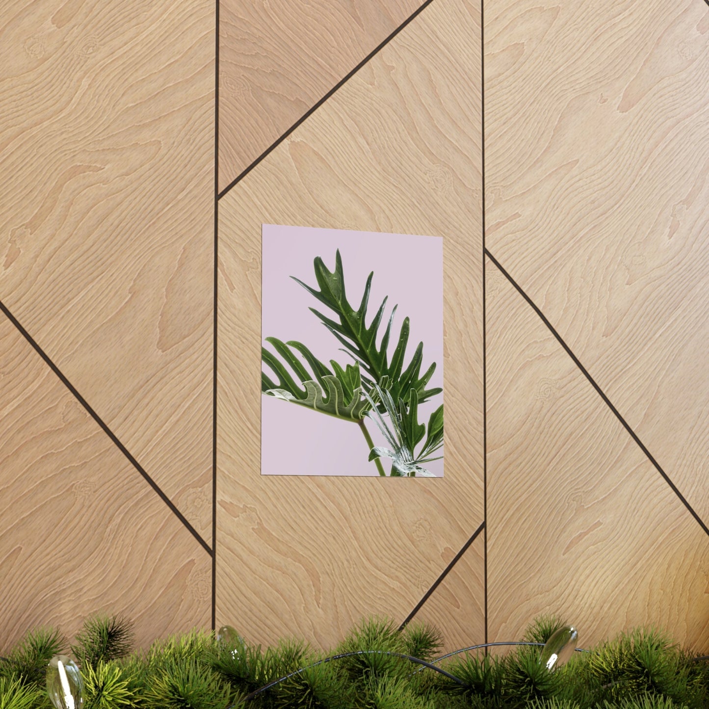 Poster with green leaf design on a wooden wall