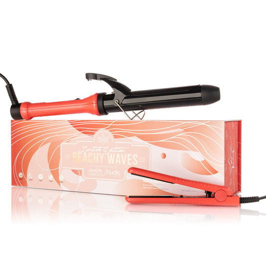 Red hair straightener and curling iron with packaging on a white background