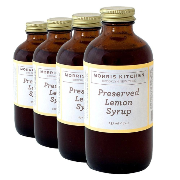Four bottles of Morris Kitchen Preserved Lemon Syrup, each labeled 8oz.