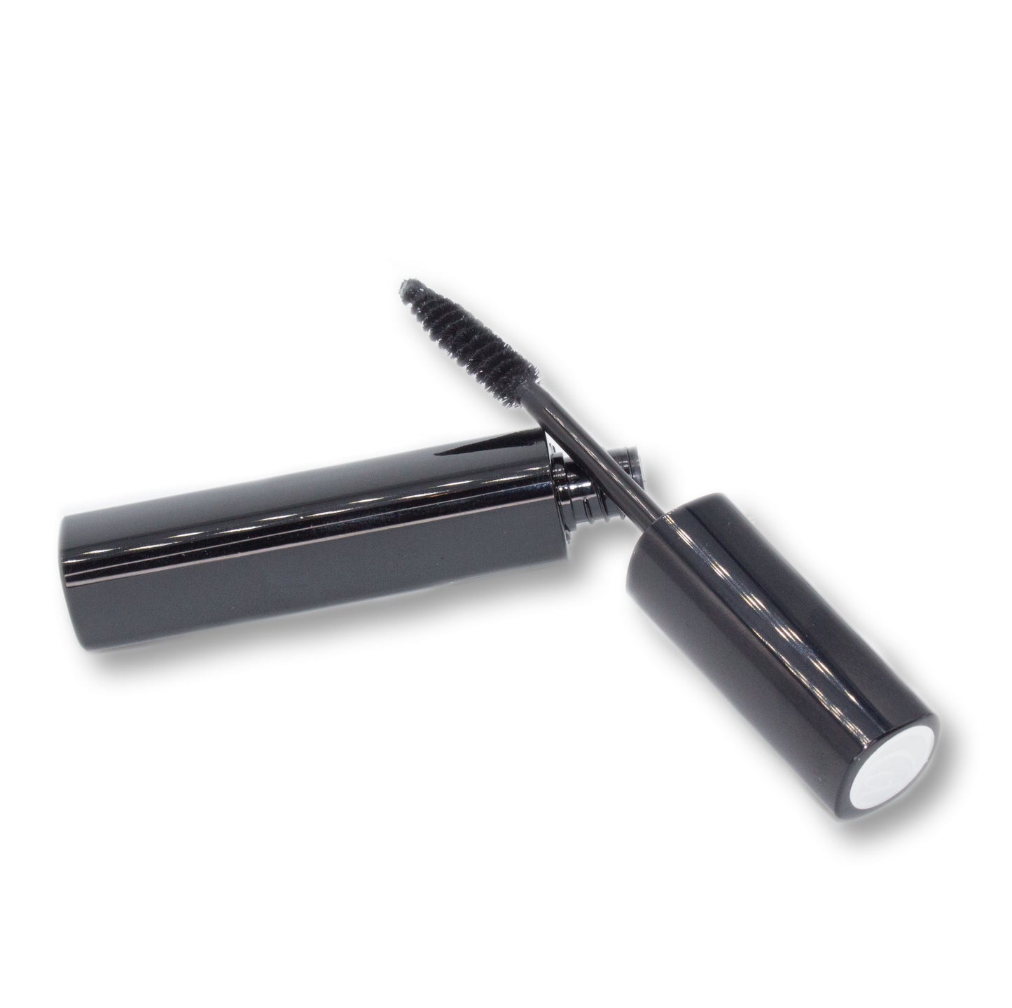 Black mascara with open cap on a white background