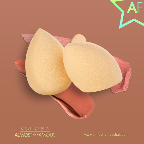 Two makeup sponges on a brown background with 'Almost Famous' branding.