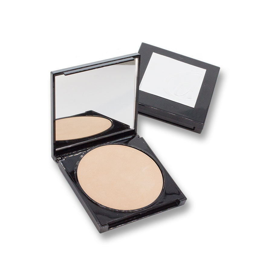Compact powder in an open case with a mirror on a white background
