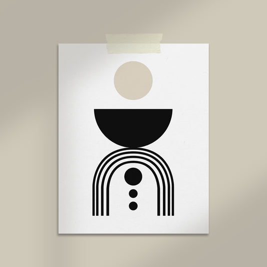 Abstract art print with geometric shapes on a beige wall.