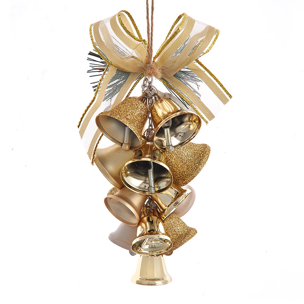 Decorative gold bell ornament with a bow on a white background