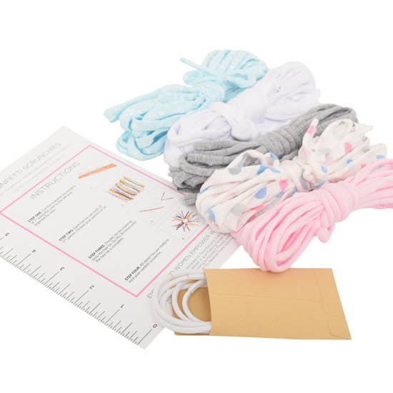 Colorful shoelaces with instructions and envelope on white background