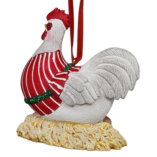 Decorative rooster ornament with a red sweater on a white background