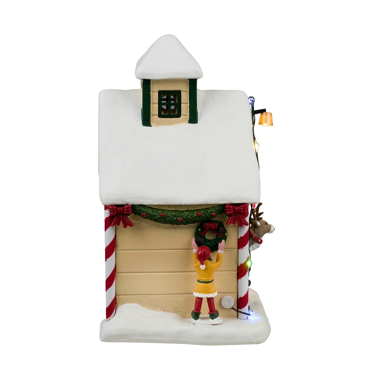 Decorative Christmas village house with an elf and candy cane decorations on a white background