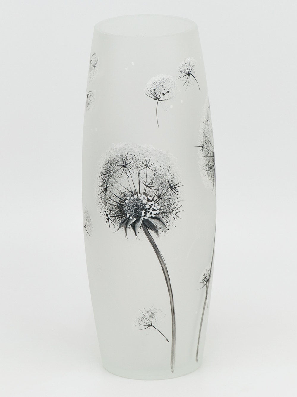 Ceramic vase with black floral design on a white background