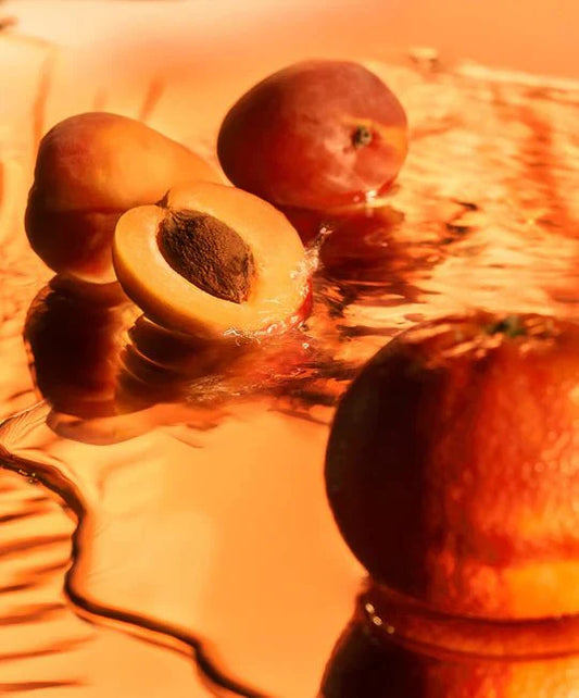 Kiwi fruits on a reflective surface with a warm color tone