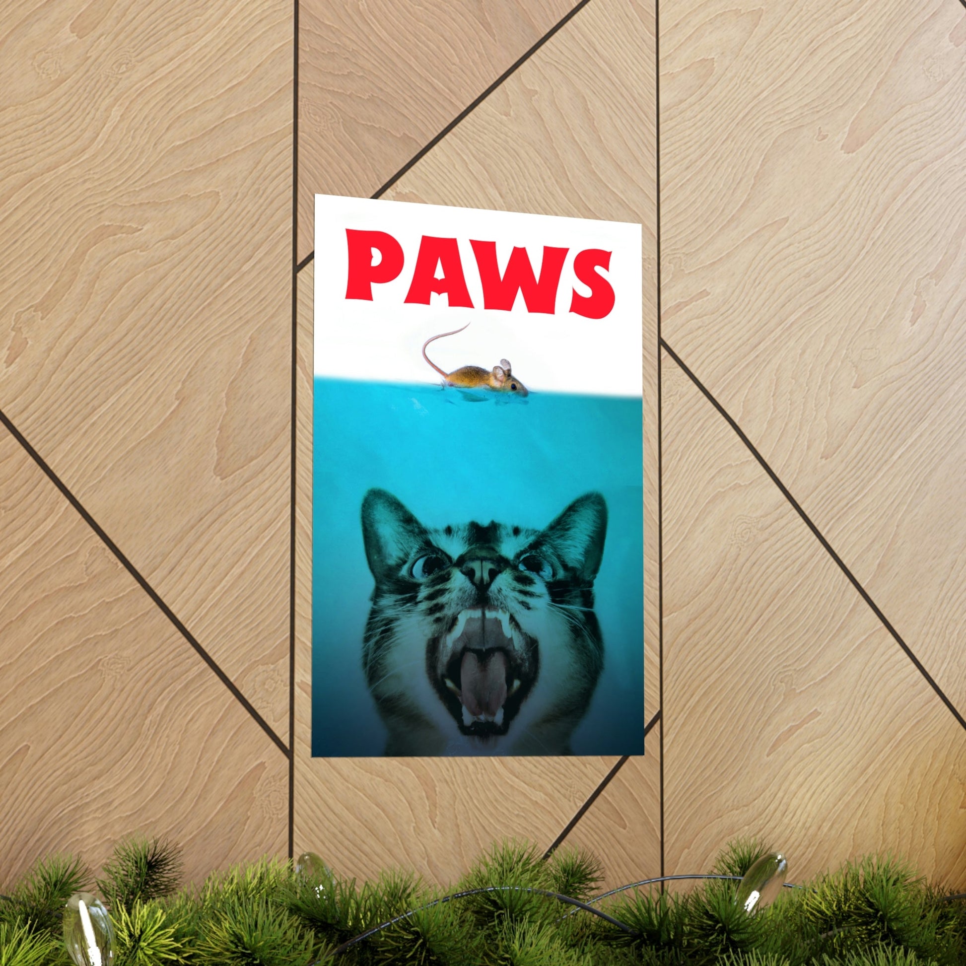 Poster of a cat with 'PAWS' text on a wooden wall.