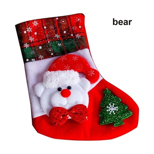 A set of Christmas stockings with festive designs including Santa Claus, reindeer, and snowflakes, displayed on a white mantelpiece.