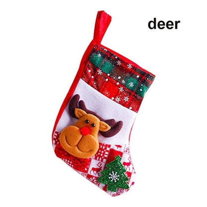 A set of Christmas stockings with festive designs including Santa Claus, reindeer, and snowflakes, displayed on a white mantelpiece.