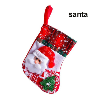 A set of Christmas stockings with festive designs including Santa Claus, reindeer, and snowflakes, displayed on a white mantelpiece.