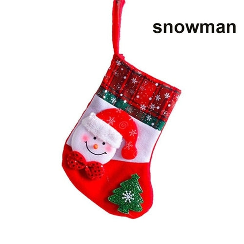 A set of Christmas stockings with festive designs including Santa Claus, reindeer, and snowflakes, displayed on a white mantelpiece.