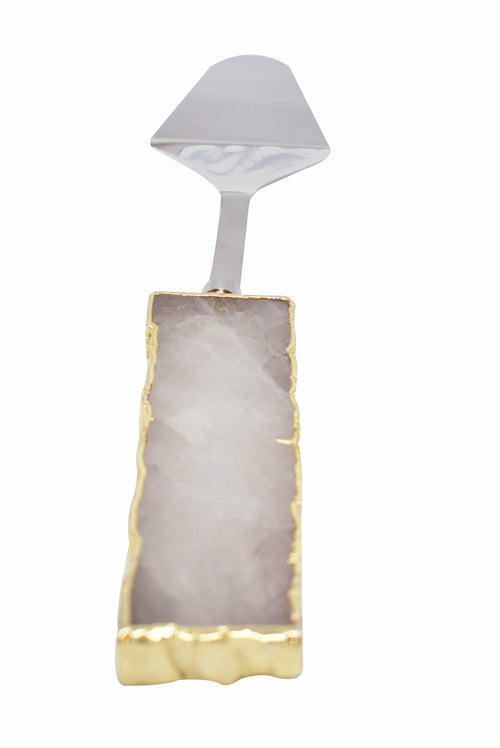 A set of three cake servers with gold trim handles and gemstone accents in amethyst, black quartz, and clear quartz.
