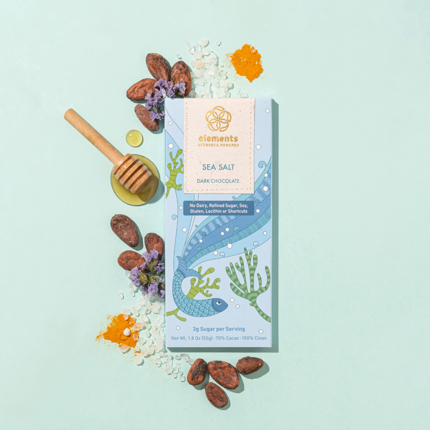 Sea Salt Dark Chocolate packaging with natural elements on a light blue background