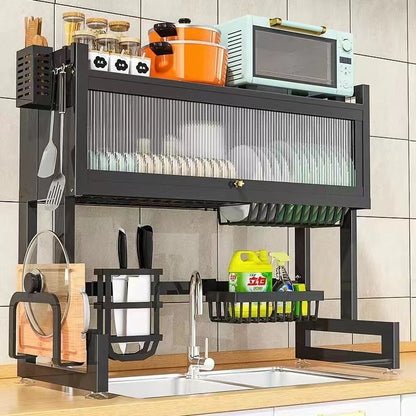A black metal kitchen sink storage stand with multiple compartments, including a surface for drying dishes and storing kitchen utensils and appliances.