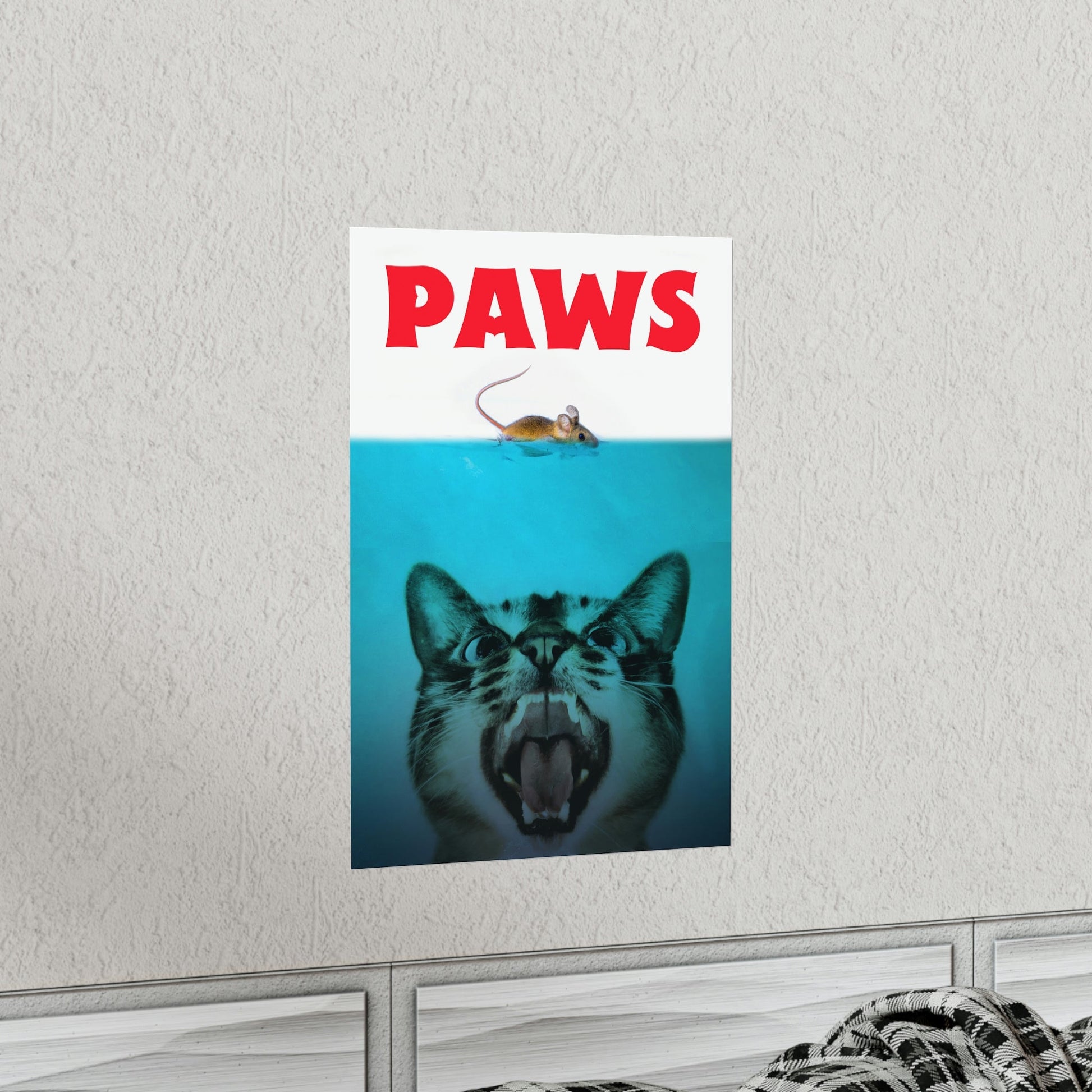 Poster with a tiger's face and 'PAWS' text on a white wall.