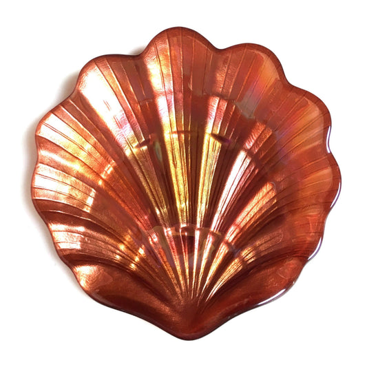 A copper-colored scallop shell-shaped glass plate with a metallic finish.