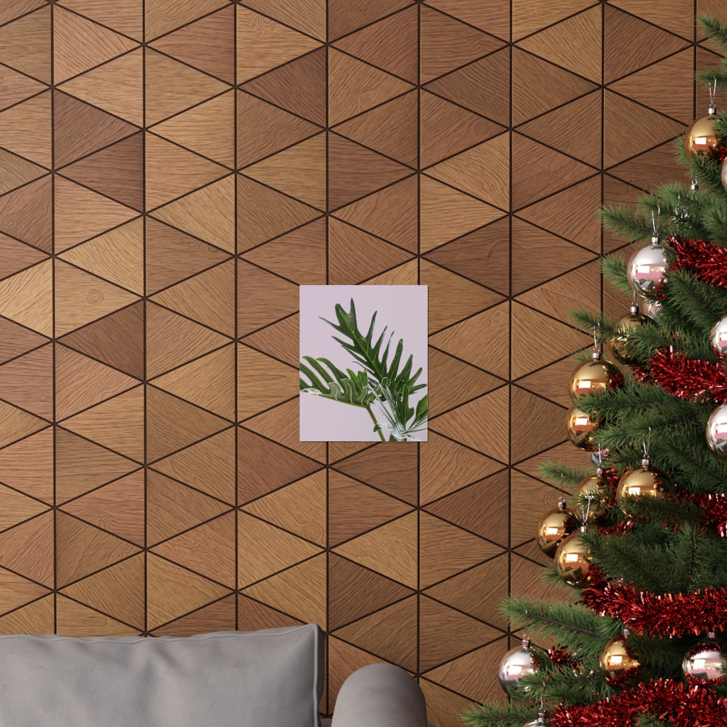 Wooden wall with geometric pattern, a small plant poster, and a decorated Christmas tree.