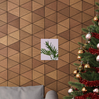 Wooden wall with geometric pattern, a small plant poster, and a decorated Christmas tree.