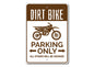 Sign with dirt bike illustration and text 'Dirt Bike Parking Only, All Others Will Be Crushed' on a white background