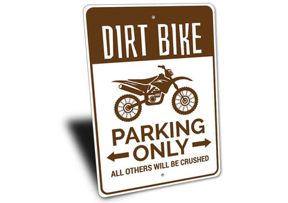 Sign with dirt bike graphic and text on a white background
