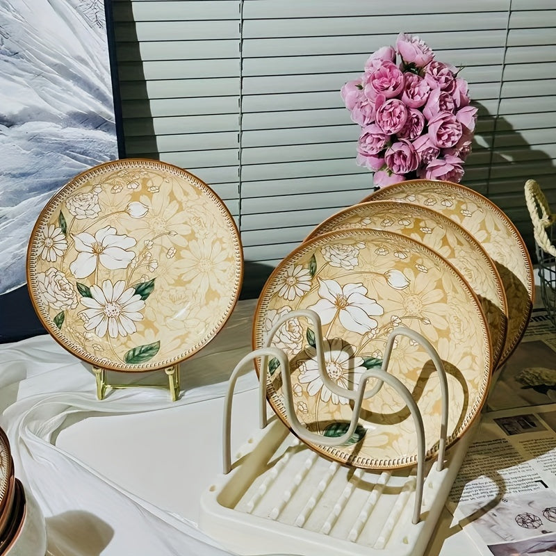 multiple floral plates on stand