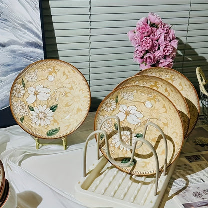 multiple floral plates on stand