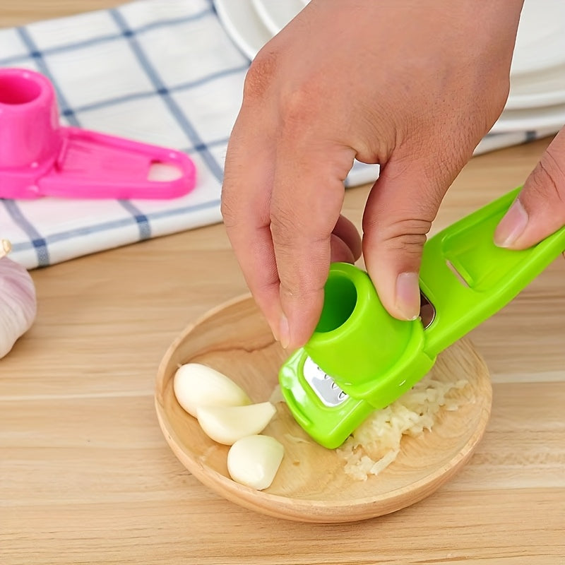 single image of green garlic press being used