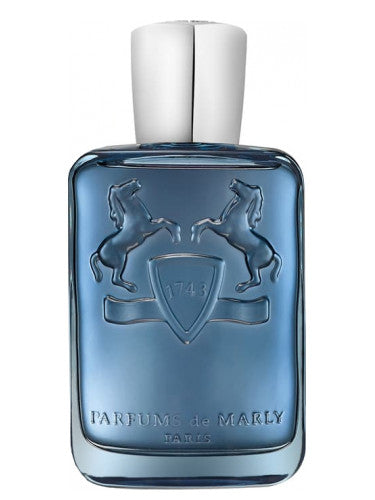 Blue perfume bottle with silver cap on a white background