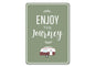 Green sign with 'Enjoy the Journey' text and a camper illustration on a white background