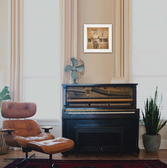 Piano in a room with a brown leather chair, fan, and framed picture on the wall.
