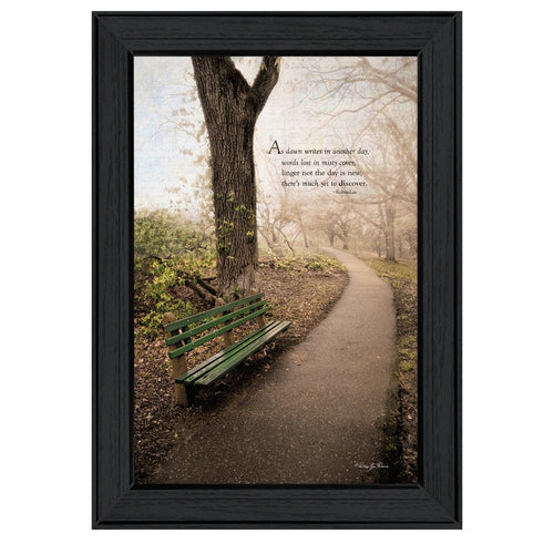Framed print of a park scene with a green bench and a quote on a white background