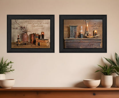 Two framed pictures on a wall with decorative elements and plants below.