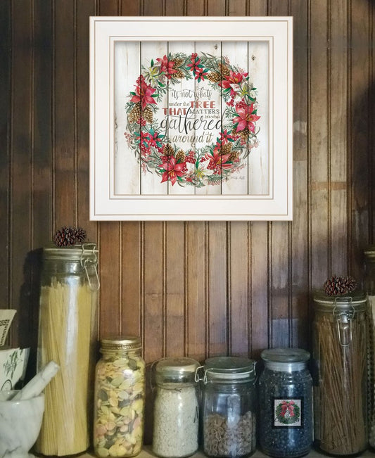 Decorative framed print with floral wreath and text on a wooden wall above jars.