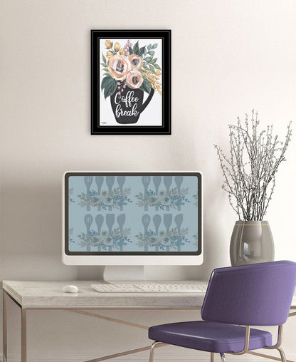 Modern office setup with a computer, desk, and decorative elements.