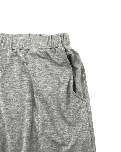 Close-up of gray athletic shorts on a white background