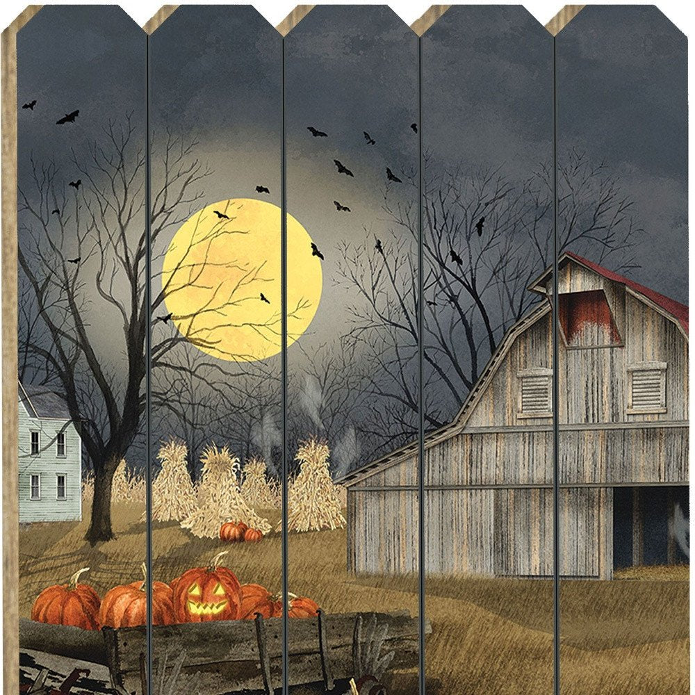 Halloween-themed wall art with pumpkins, barn, and full moon on wooden panels.